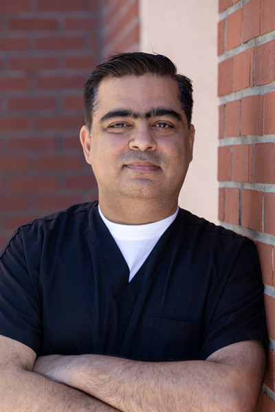 Headshot of our Mira Loma dentist, Dr. Sikka, of Higher Ground Dentistry 