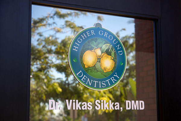 Office sign on door at Higher Ground Dentistry near Mira Loma, CA 